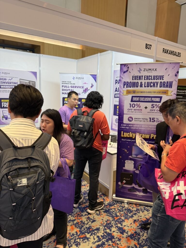 Zumax digital marketing team busy entertaining the many customers that stop by the booth